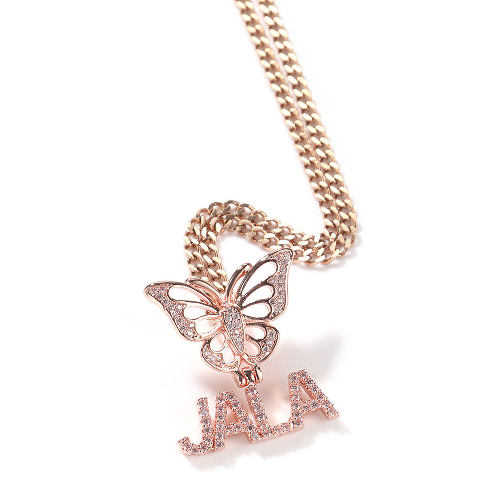 Rose gold butterfly necklace with 'JALA' pendant on a white background