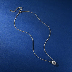 Silver necklace with a pendant on a blue background