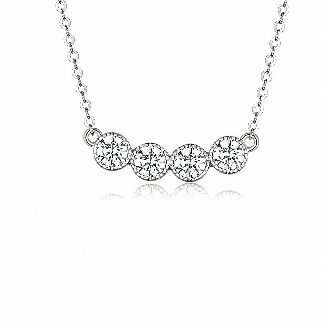 Silver necklace with three round diamonds on a white background