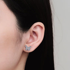 Close-up of a person wearing butterfly-shaped earrings against a neutral background Butterfly Earrings for Women S925 Sterling Silver Moissanite Aru collection