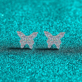 Butterfly-shaped earrings on a teal glittery background Butterfly Earrings for Women S925 Sterling Silver Moissanite Aru collection