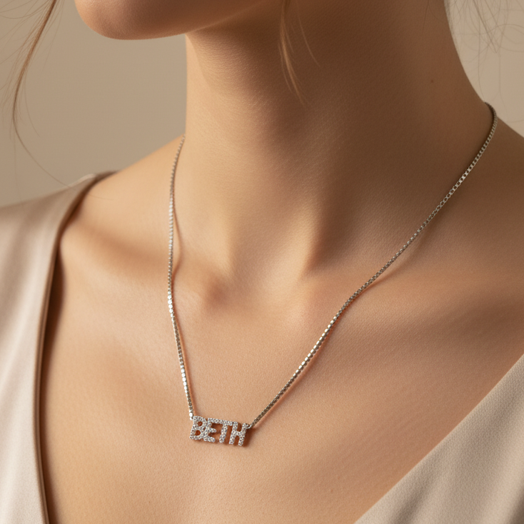 Personalized 925 sterling silver name necklace with zircon details. Adjustable 21cm to 50cm chain. Comes in a gift box. ARU Collection