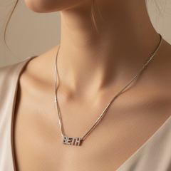 Personalized 925 sterling silver name necklace with zircon details. Adjustable 21cm to 50cm chain. Comes in a gift box. ARU Collection