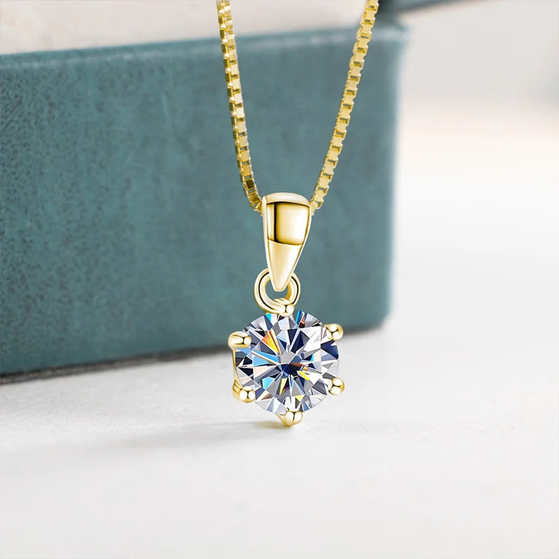 Gold moissanite pendant necklace, light background