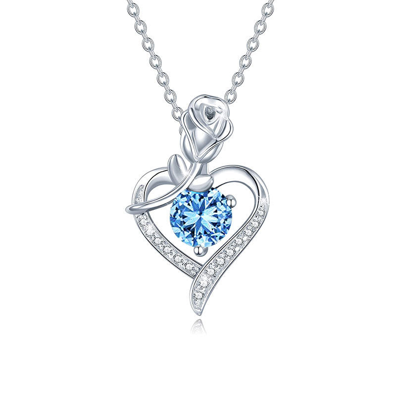 Silver necklace with a heart-shaped pendant featuring a blue gemstone on a white background Heart Rose Moissanite Pendant Necklace S925 Sterling Silver aru collection
