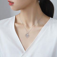 Necklace with a heart-shaped pendant worn by a model in a white top. Heart Rose Moissanite Pendant Necklace S925 Sterling Silver aru collection