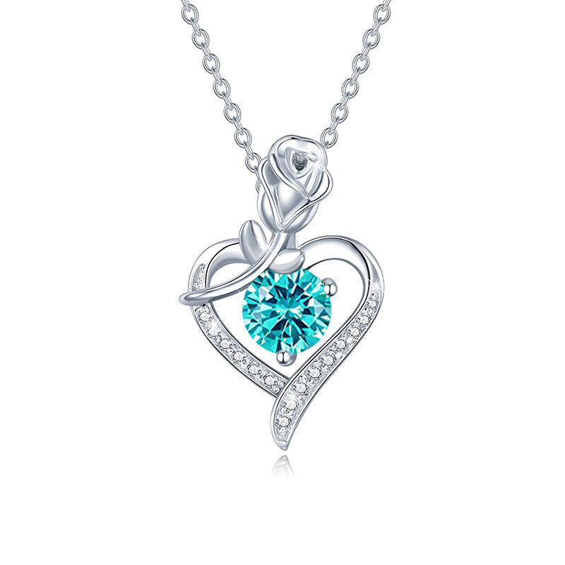 Silver necklace with a heart-shaped pendant featuring a blue gemstone on a white background Heart Rose Moissanite Pendant Necklace S925 Sterling Silver aru collection