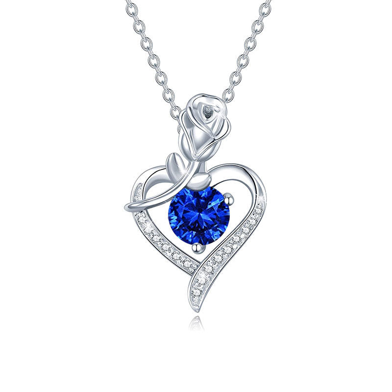 Silver necklace with a blue gemstone heart pendant on a white background Heart Rose Moissanite Pendant Necklace S925 Sterling Silver aru collection 1