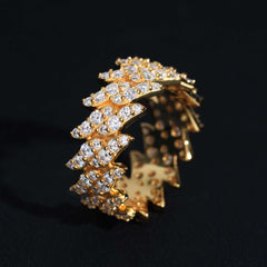 Gold and diamond earring on a black background