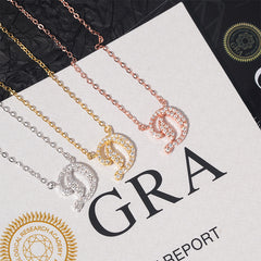 Three necklaces in gold, rose gold, and silver on a white surface with 'GRA' branding.