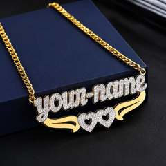 Gold necklace with 'your-name' and heart designs on a dark background