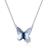 Butterfly-shaped pendant necklace with blue gemstone on a white background