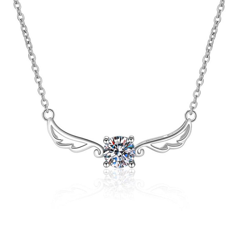Silver necklace with angel wing design and central gemstone on a white background angel wing design Silver necklace Aru collection