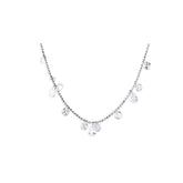 Necklace with clear gemstones on a white background aru collection