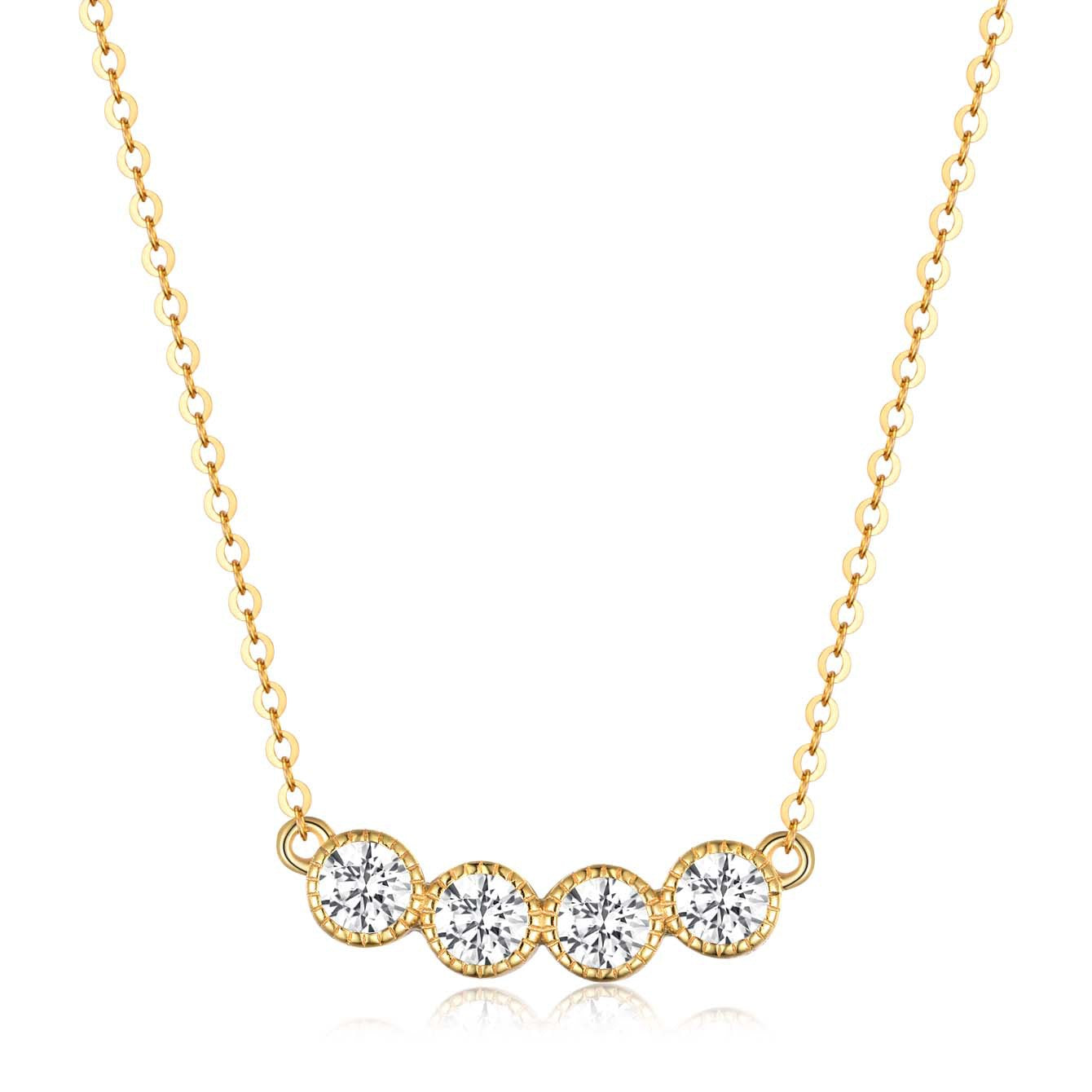 Gold necklace with four round diamonds on a white background