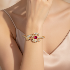 Gold open cuff bracelet with red rhinestone gemstone