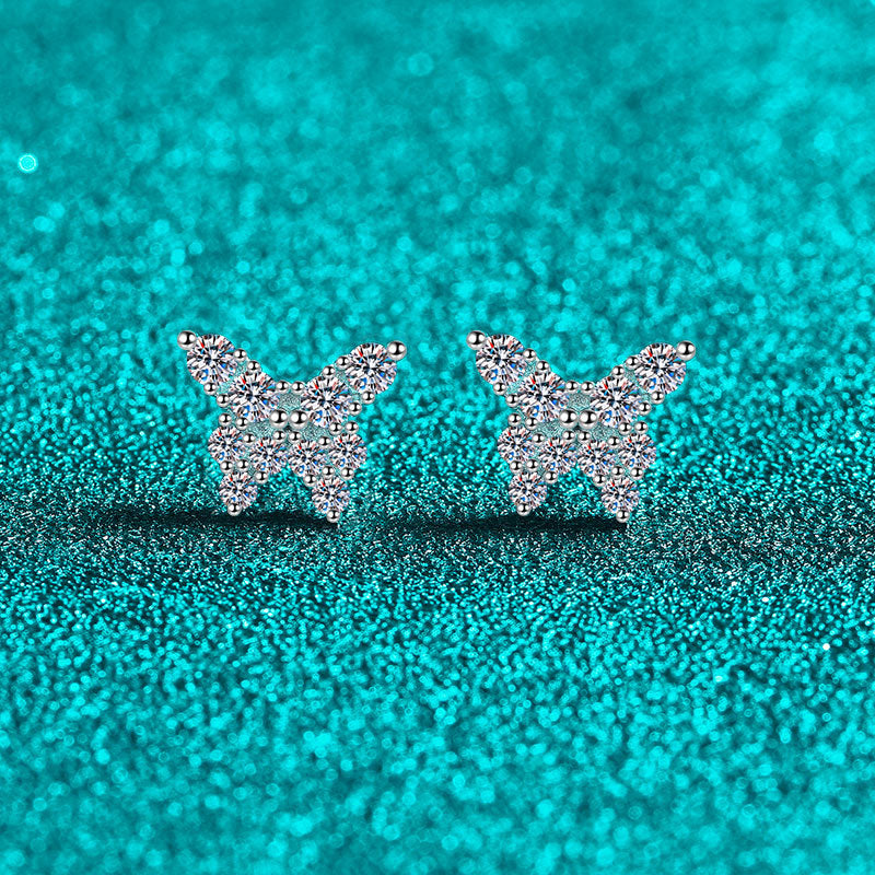 Butterfly-shaped earrings on a teal glittery background Butterfly Earrings for Women S925 Sterling Silver Moissanite  Aru collection