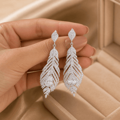 Pair of feather-shaped silver stud earrings