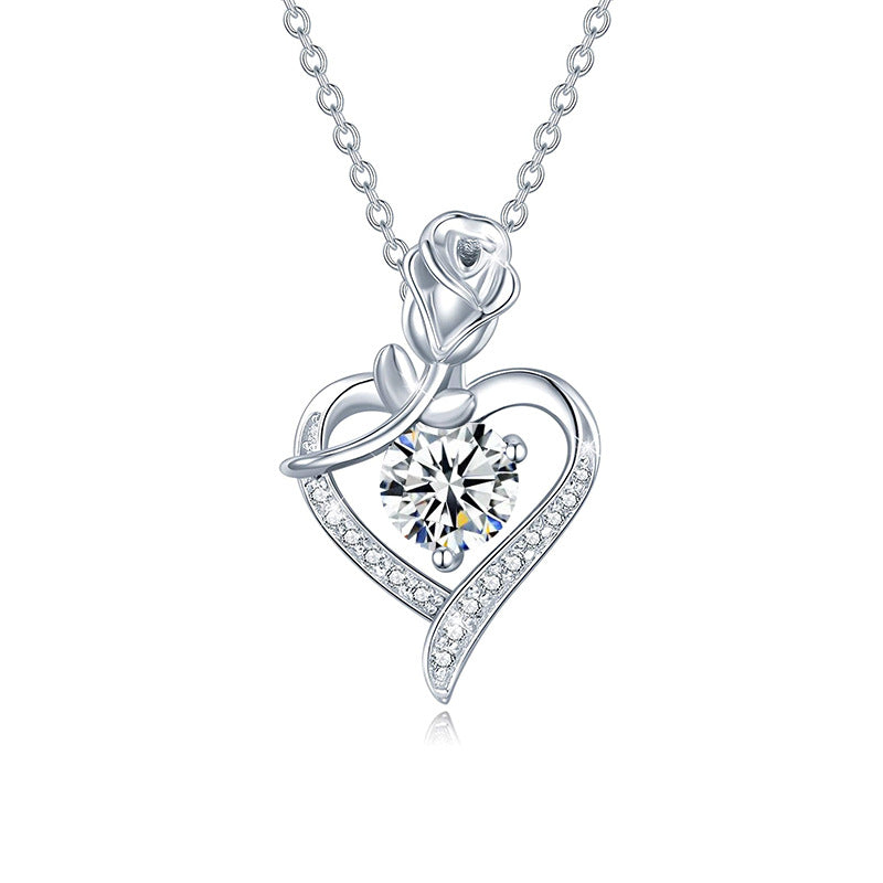Silver necklace with a heart-shaped pendant featuring a rose and gemstone on a white background  Heart Rose Moissanite Pendant Necklace S925 Sterling Silver aru collection 1
