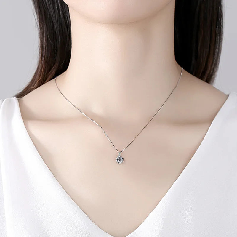 Moissanite pendant necklace displayed on neckline