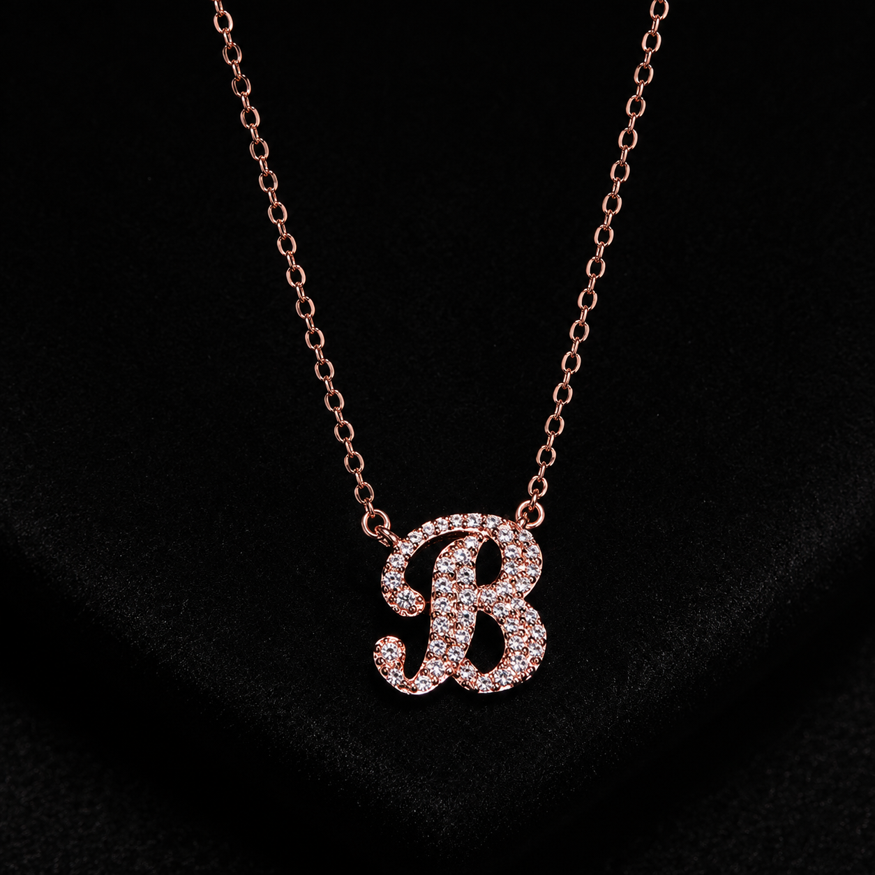 Necklace with a letter 'B' pendant on a black background