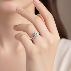 Cross moissanite ring on a hand, sterling silver
