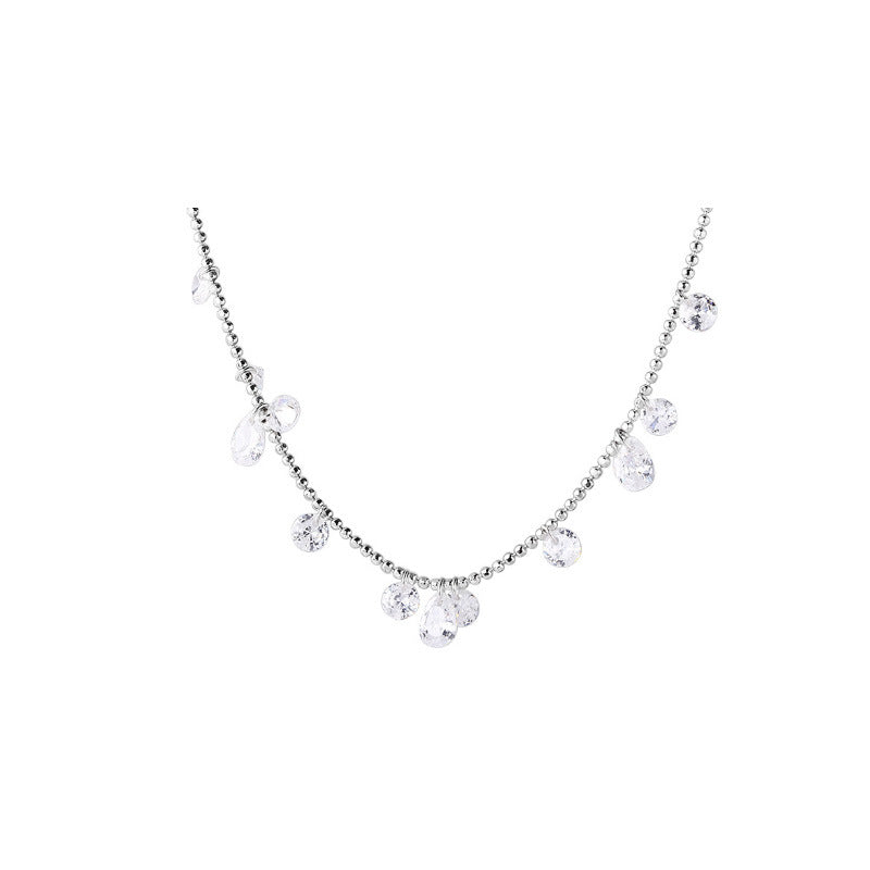 Necklace with clear gemstones on a white background aru collection